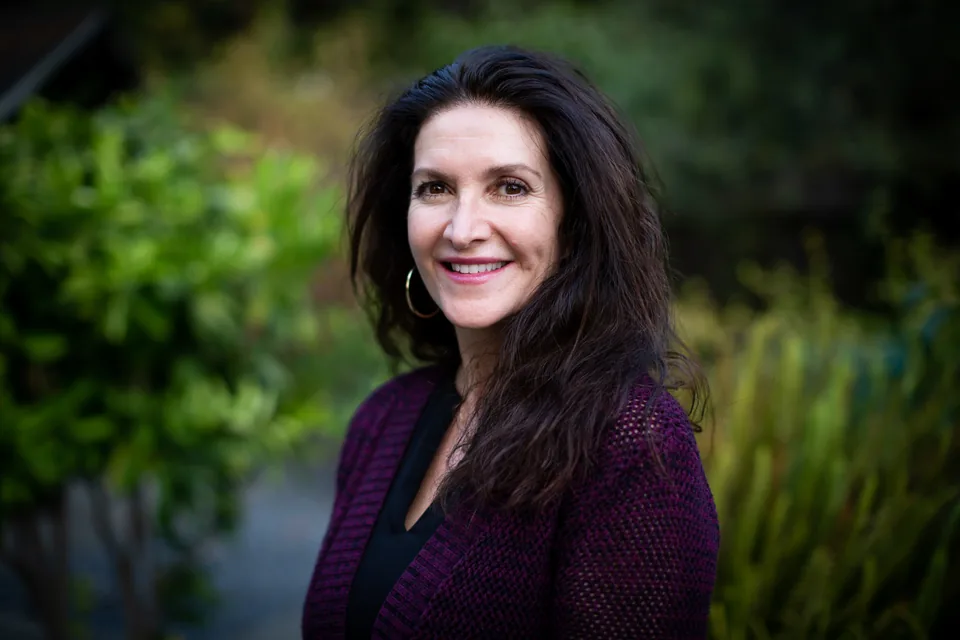 Linda Gozurian McMahon smiling outdoors